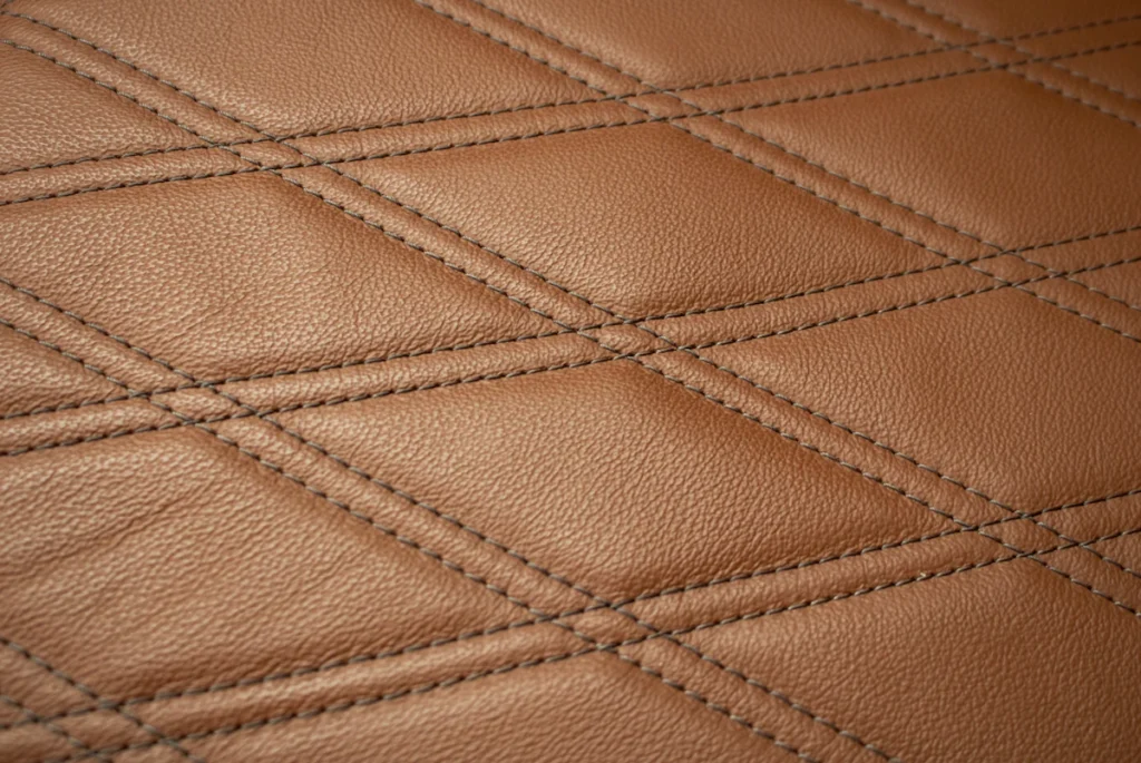 Diamond-stitched leather material detail for custom fitness accessories