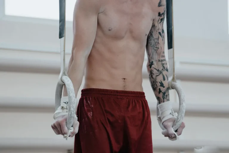 Athlete wearing gymnastics grips on rings