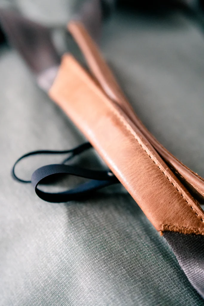 Brown leather strap with a black cord loop