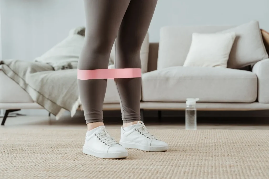 Pink loop band worn above the knees