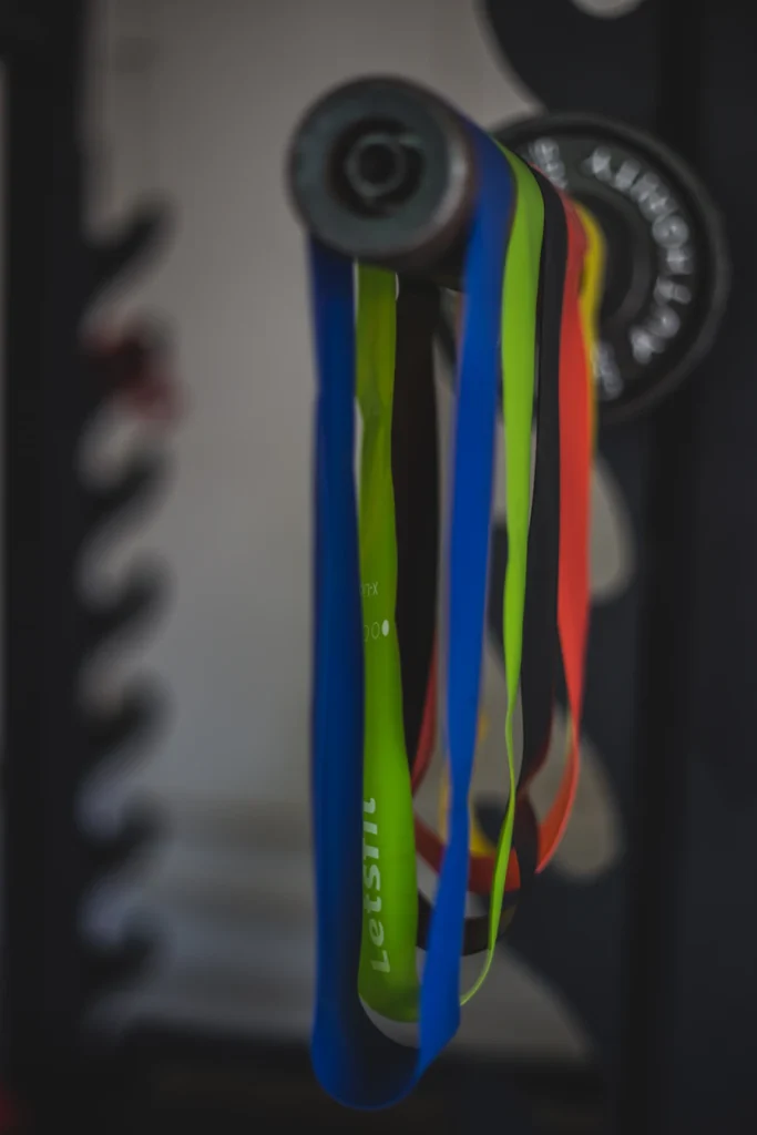 Resistance bands in multiple resistance levels hanging in a training space