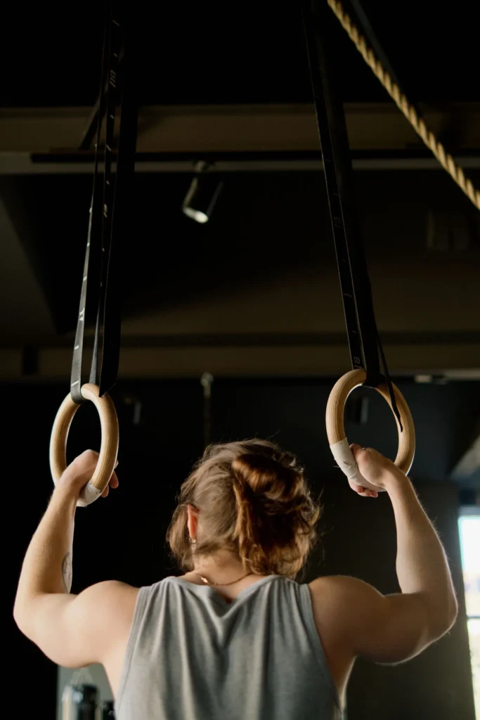 Athlete training on gymnastic rings in a functional gym