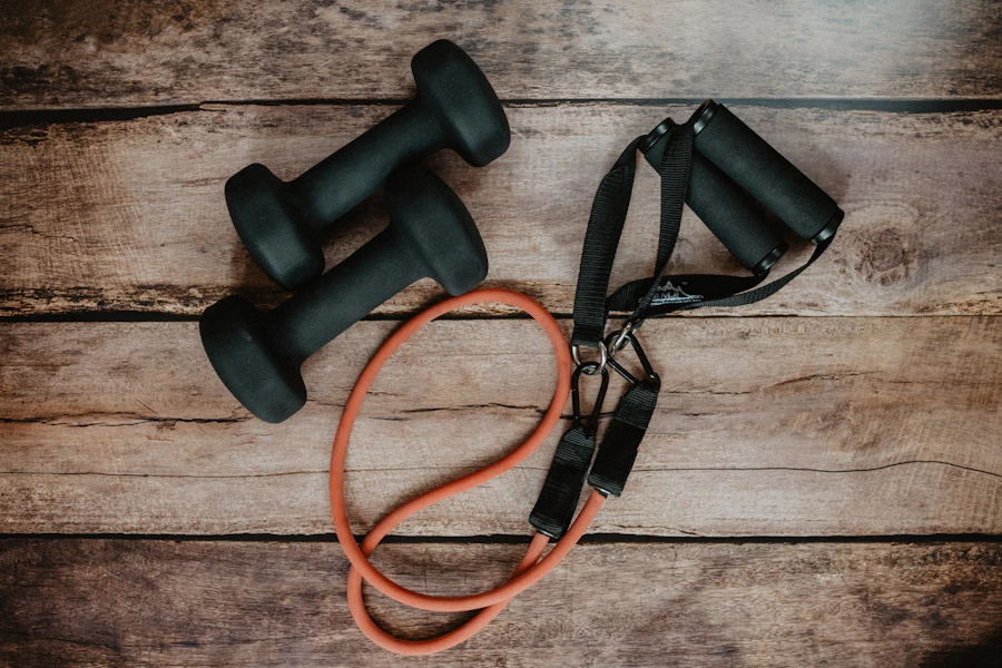 Strength training accessories including resistance tubes with handles and dumbbells