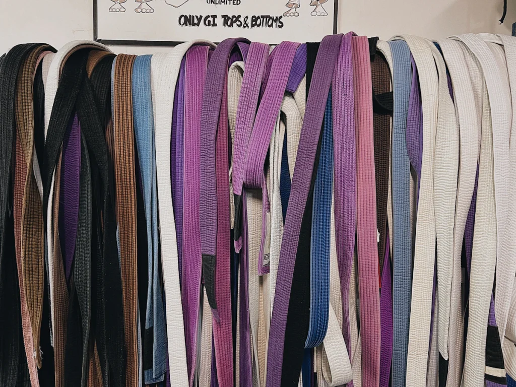 Webbing straps in a range of colors hanging in a workshop